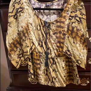 Printed flair shirt with sleeves that that flow.